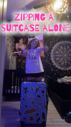 Zipping a suitcase